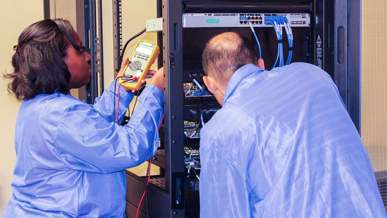 Lockheed Martin employees working on the Processor-in-the-loop testbed for Next Generation Interceptor (NGI)